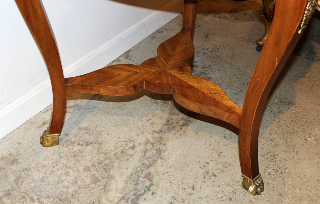 Carved Baker Furniture Fruitwood and Mahogany Center Table with Pinwheel Inlay