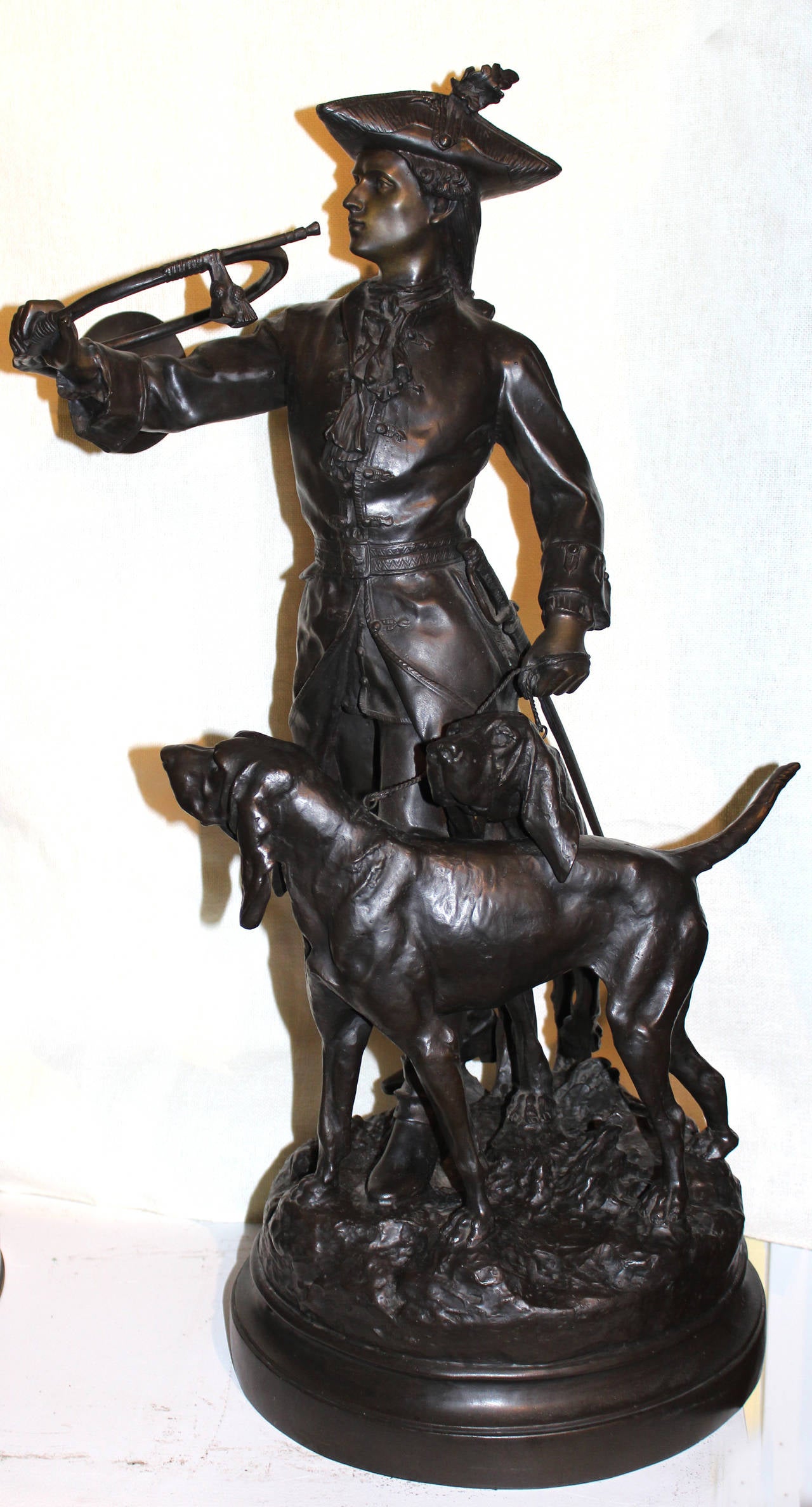 This beautifully detailed bronze casting was created by sculptors Hippolyte-Francois Moreau (French, 1832-1917), who sculpted the hunter and Prosper Lecourtier (French, 1851-1924), who sculpted the dogs. Its title in the original French is Piqueur