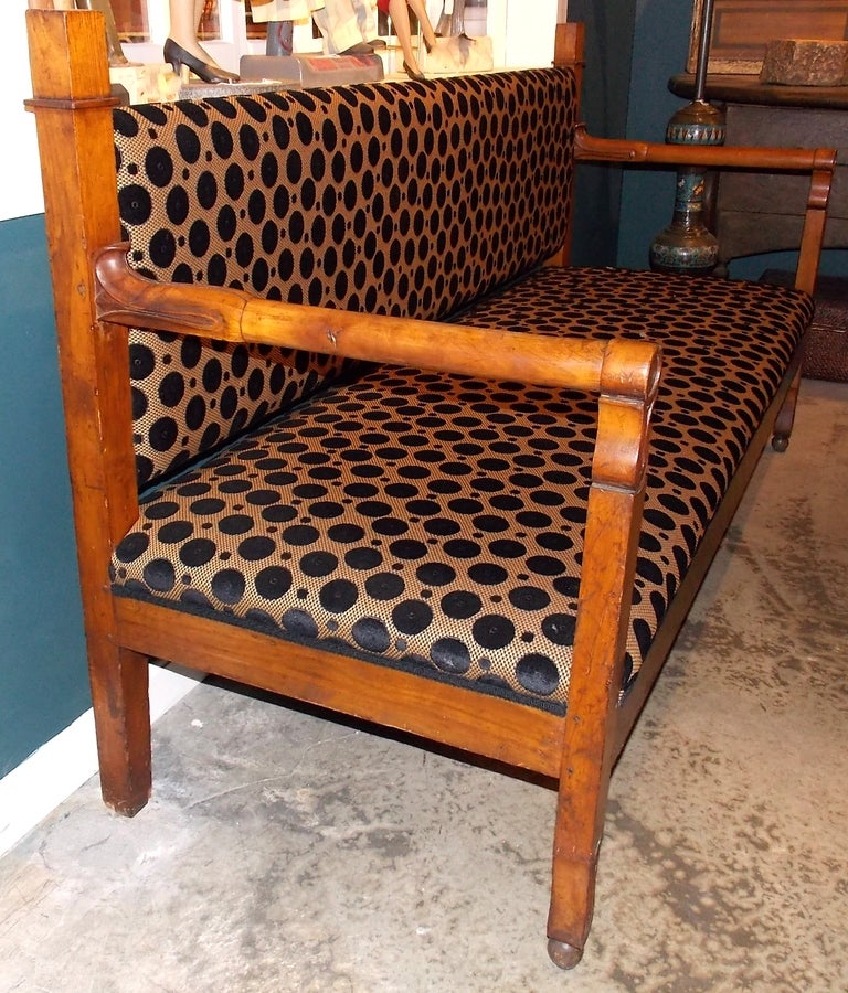 19th c. French Empire fruit wood settee with a warm patina. Freshly upholstered. Circa 1815.  Nice form and carving.