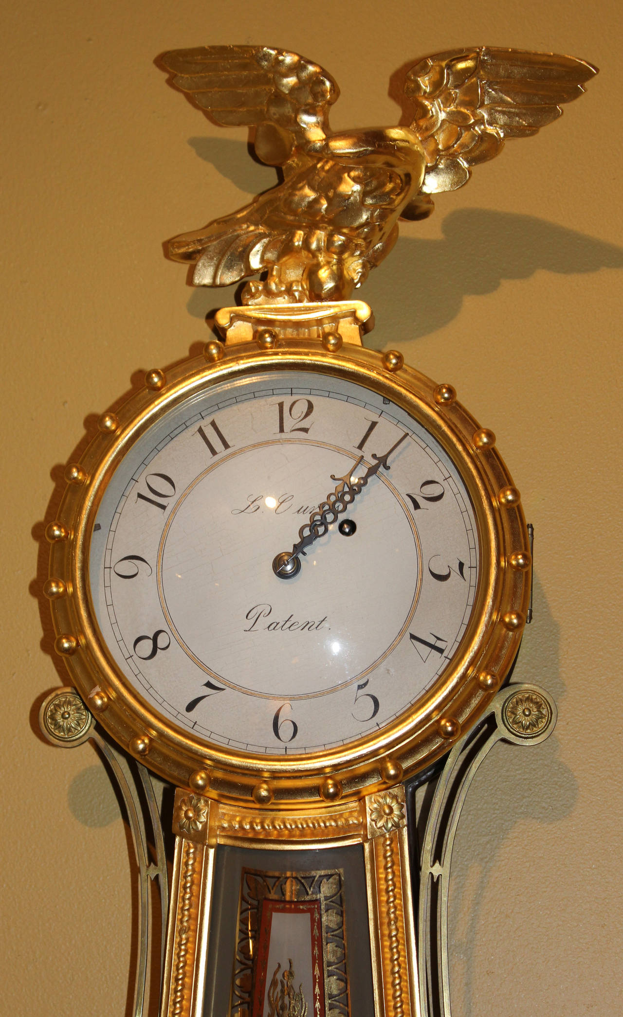 This is an extraordinary copy of an original Lemuel Curtis elegant 8 day wall clock. These clocks were considered one of the finest available in the 1800’s. Girandole and banjo clocks by Burleigh are highly sought after due to the quality and close