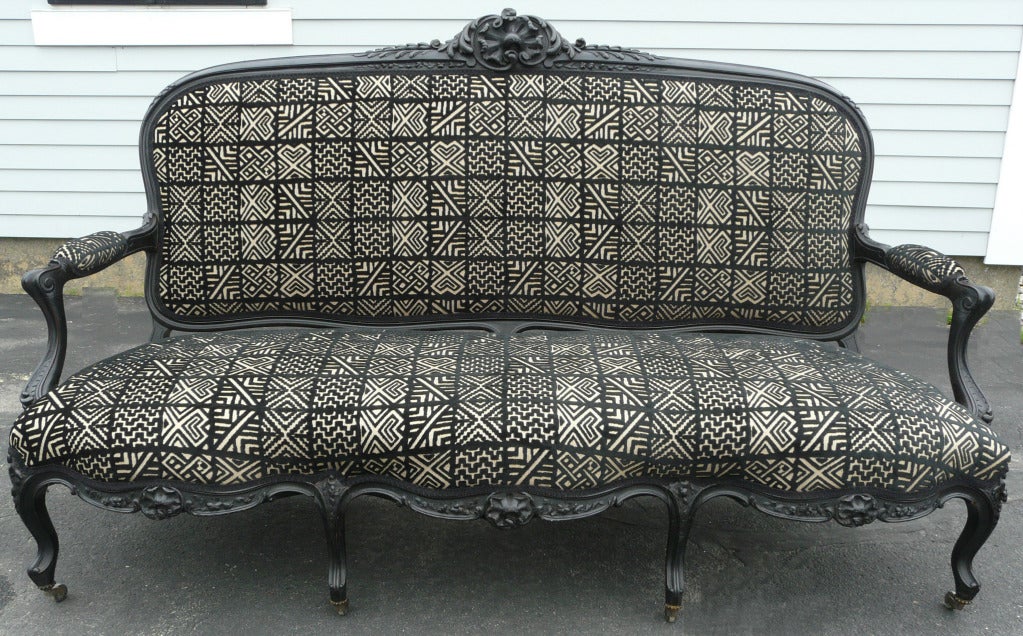 19th century Rococo Revival carved ebonized oak settee or sofa with abstract square pattern, cut velvet upholstery, circa 1860. Fabric by Clarence House. Measures: Seat height is 18