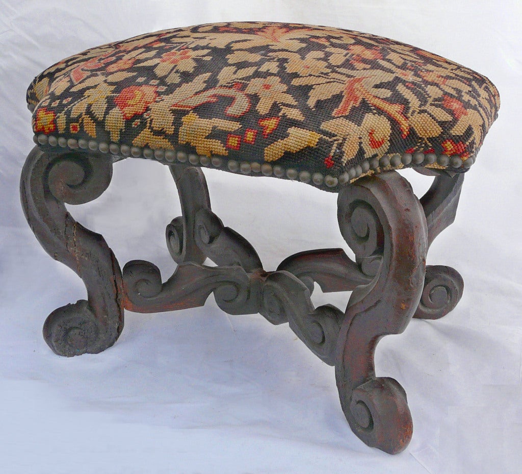 Turtle top stool with nicely carved, dark oak base and needlepoint cover.