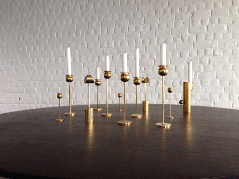 Set of 12 brass candlesticks.