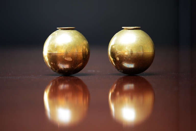 Two brass spherical candleholder