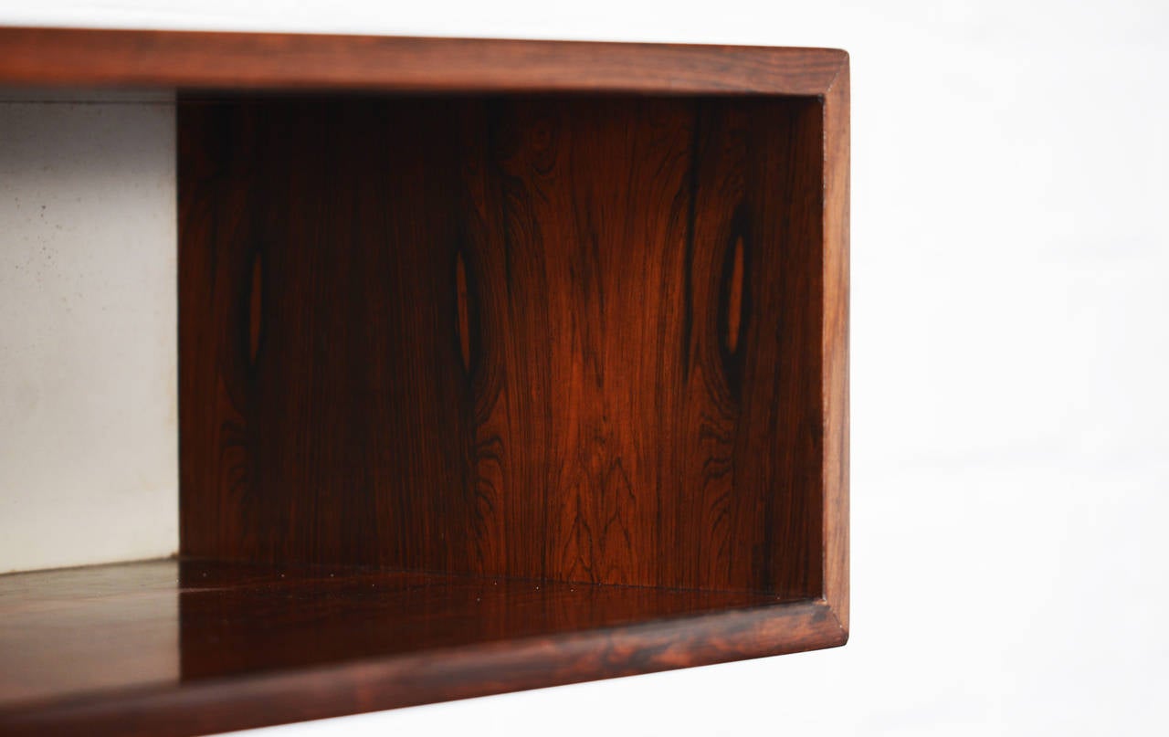 Kai Kristiansen large rosewood floating console. Massive rosewood drawers. One open space.