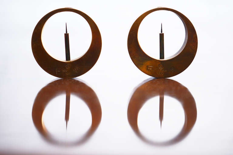 Two rare round brass candleholder