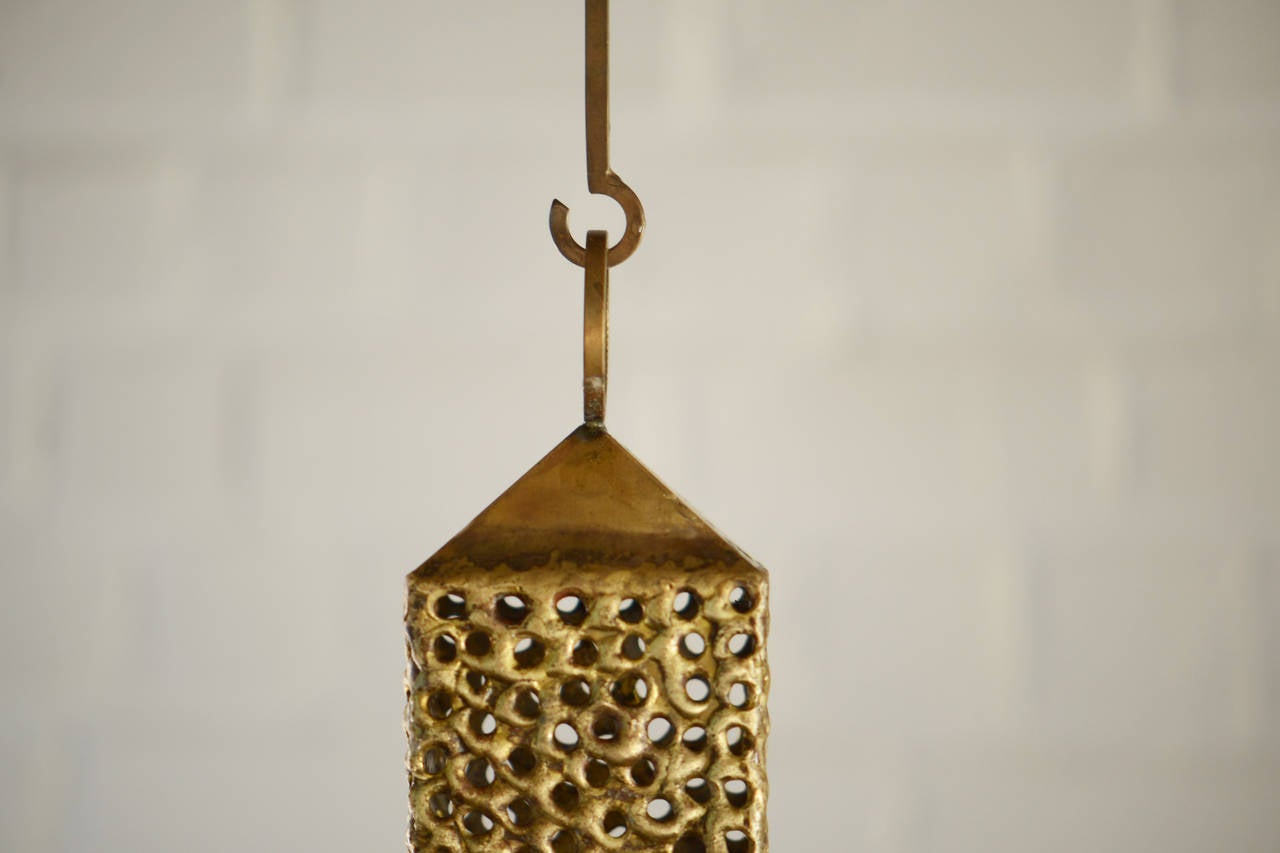 Pierre Forssell rare ceiling brass lantern for one long candle.

 

Pierre Forssell was employed at the Skultuna manufacture from 1955-1986. He worked with brass and developed modern and sculptural form to lamps, candlesticks and different