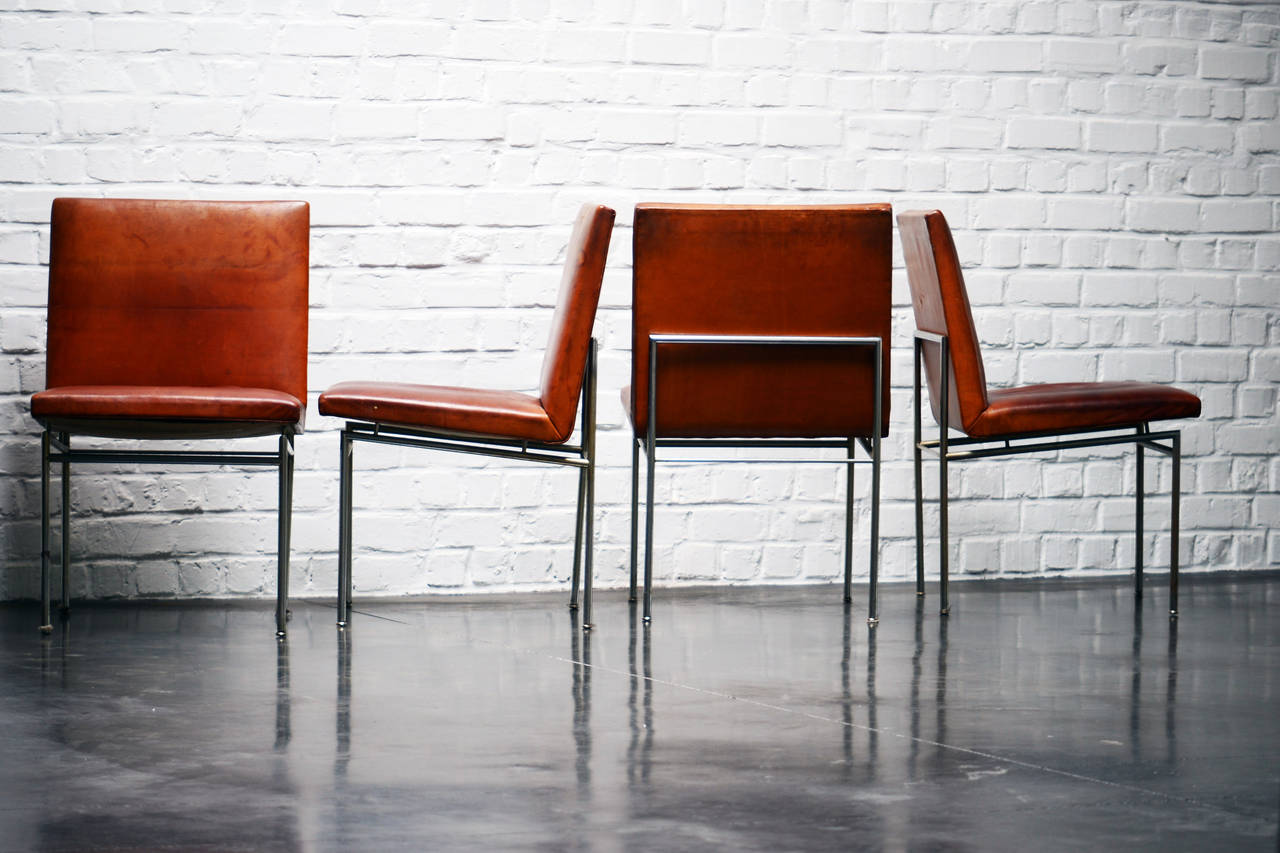Poul Nørreklit four cognac patinated leather chairs made for P. Nørreklit agencies in 1960.