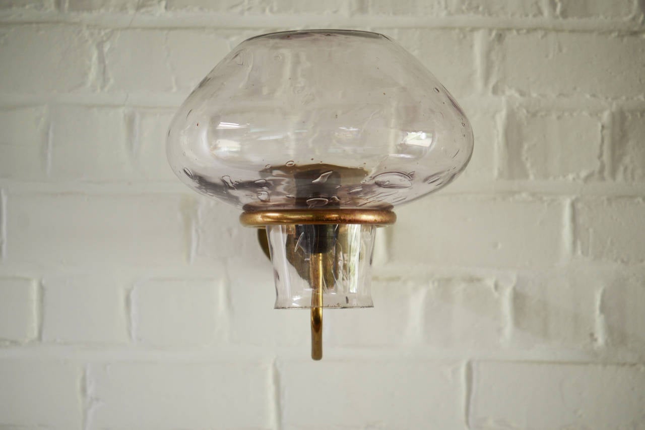 Large Asplund glass and brass wall lamp. Can be used outside as the globe is just open on the bottom.