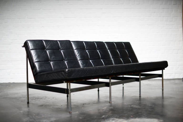 One very rare sofa made of steel, painted steel and slats of moulded rosewood. The original cushions are made of black leather. There is a matching armchair available. Model 416.

One owner from new. These come from the same family and first owner