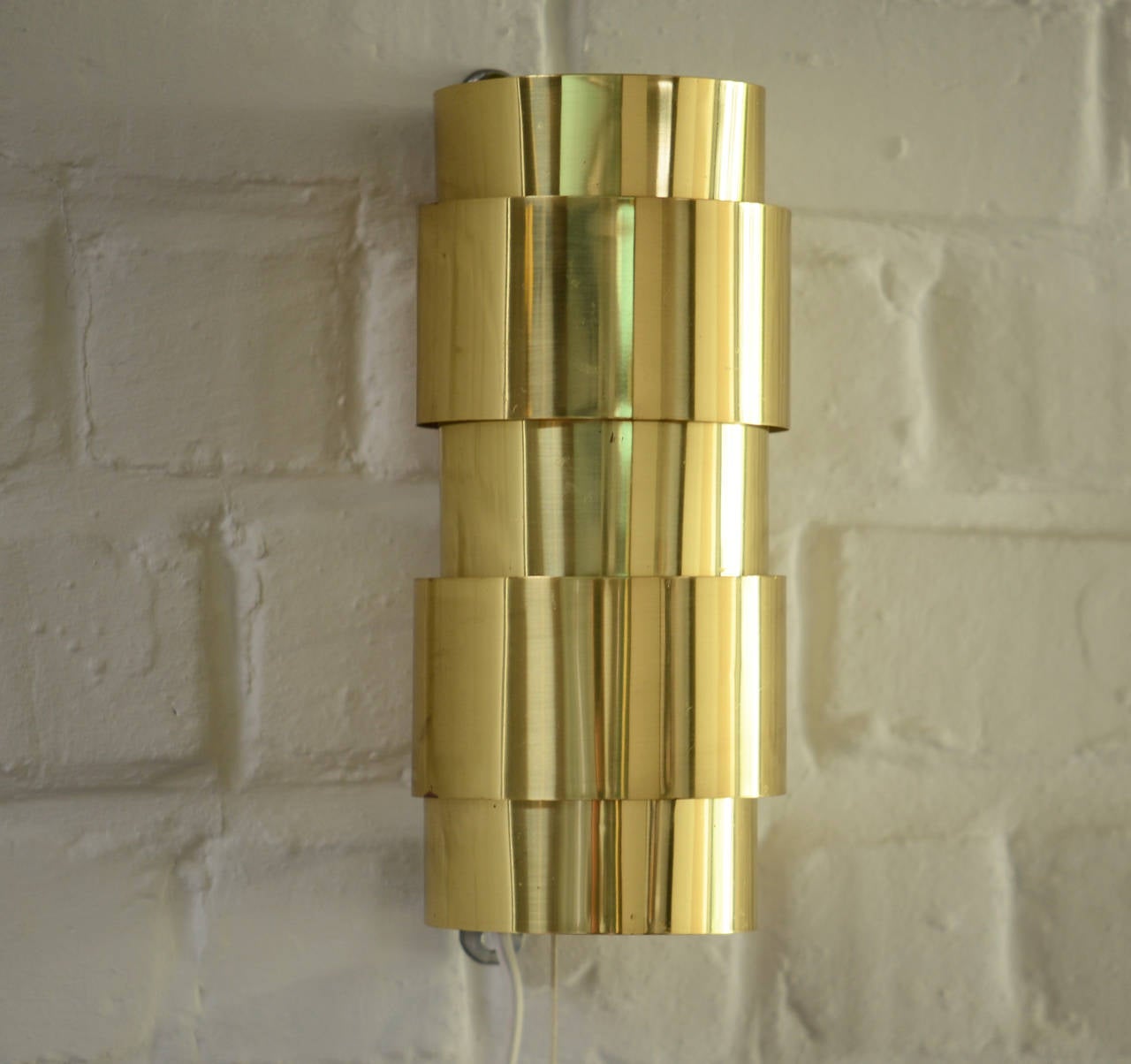 Hans-Agne Jakobsson brass wall lamps made by Markaryd, Sweden.

Two available.