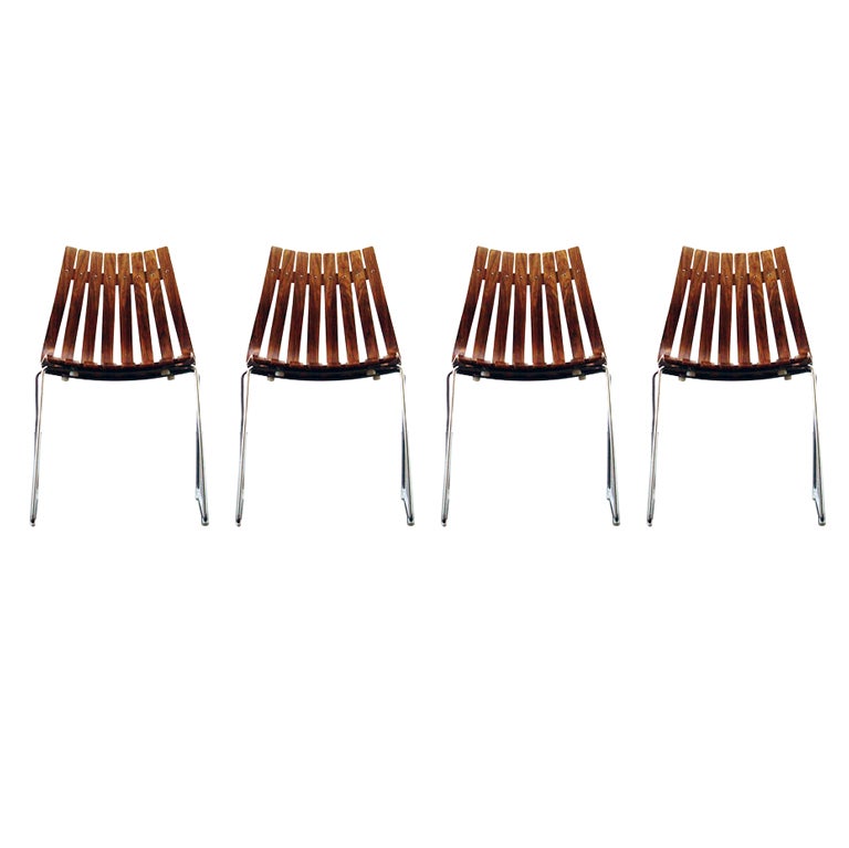 Set of four stackable rosewood chairs. Made in the 