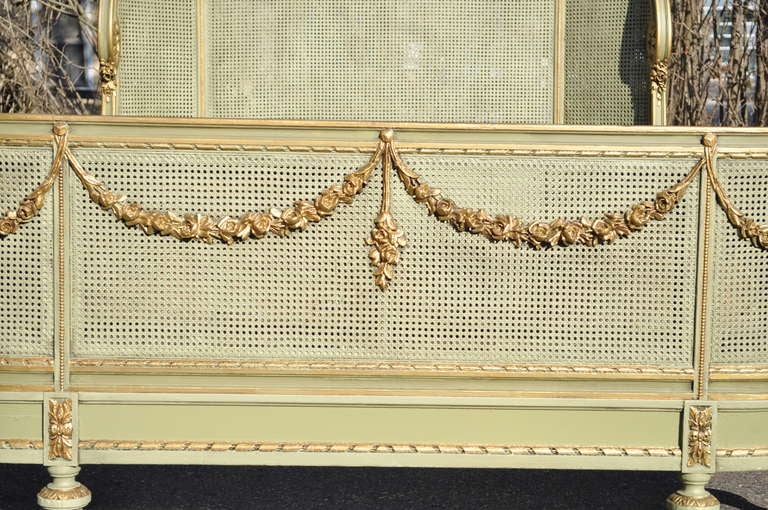 Circa 1900 French Louis XV / XVI Style Green & Gold Painted Carved and Cane Bed Bon état à Philadelphia, PA