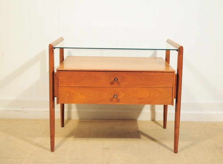 Rare Mid Century Modern Drexel Furniture Company Walnut and Glass Top Occasional Table/Nightstand having two dovetailed drawers, floating form, tapered legs, book matched veneer, and clean modern lines from Drexel's Parallel Line. The designer of