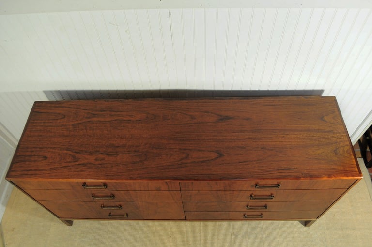 Stunning Mid Century Modern Figured Walnut 8 Drawer Dresser / Credenza on a brushed metal base by Founders and attributed to Milo Baughman. This high quality item features 8 dovetailed drawers, beautiful wood grain, intentional and attractive