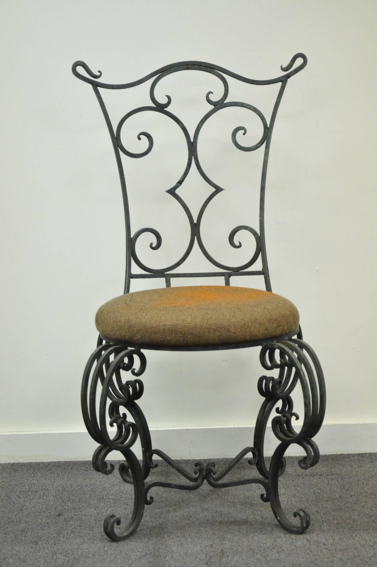 Stunning Vintage French Art Nouveau Style Scrolling Side Chair with a Hand Wrought and Forged Iron Frame. Item features the most beautiful and whimsical lines throughout including the ornate back rest, finials, legs, and stretcher supported base.