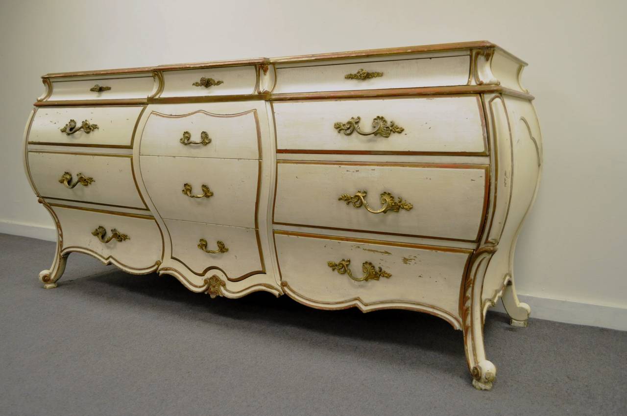 Beautiful, custom made, Vintage Italian, Bombe form Dresser or Credenza in the Frcnh Rococo taste. This high quality chest of drawers features 12 drawers with the top three having dovetailed construction, shapely bombe form, elegant carvings,