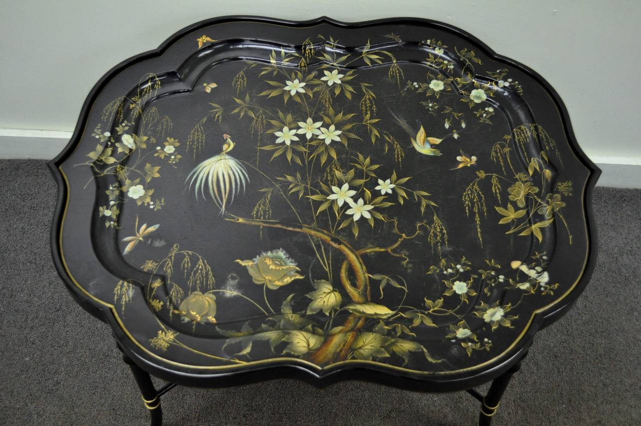 Stunning English scalloped paper or papier mâché tray (believed to be 19th century) on Stand with hand-painted floral and bird decoration. Faux bamboo form ebonized and gold gilt, Chinese Chippendale style, Stand or coffee table base is believed to