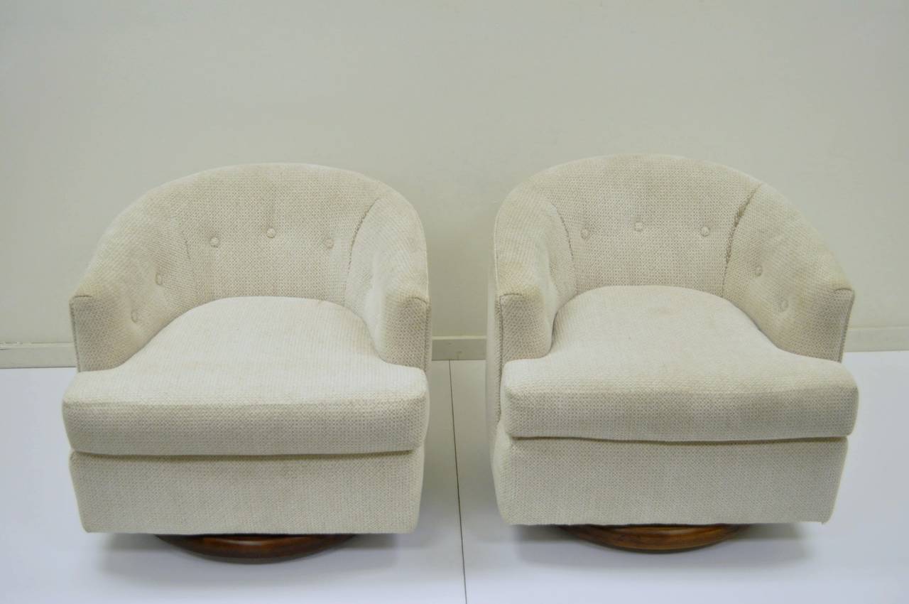 American Pair of Walnut Base Swivel Barrel Back Club or Lounge Chairs after Milo Baughman
