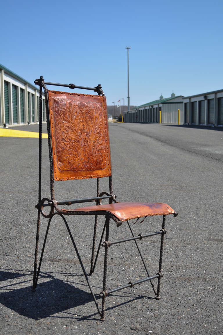 Remarkable high quality Mid 20th Century Set of 4 Iron Dining Chairs with Distressed Tooled Leather Seats and Backs attributed after Ilana Goor. Each frame has unique rustic joinery which is very reminiscent of Brutalist designed furniture. The