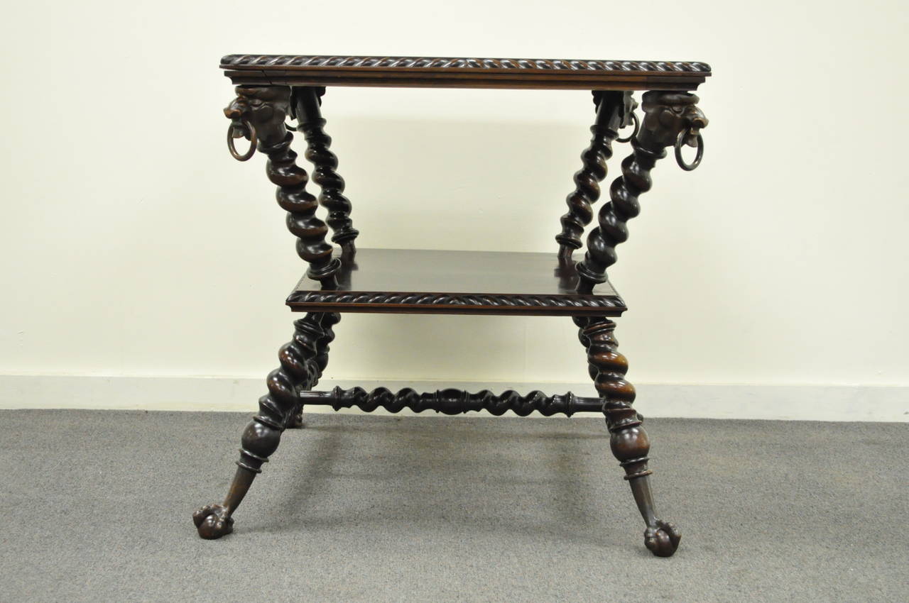 Beautiful Victorian solid mahogany parlor table with barley twist legs by the Merklen Brothers. The table has very attractive angled legs, barley twist stretchers, exquisite bronze lions heads at the corners and brass ball and claw feet. The brass