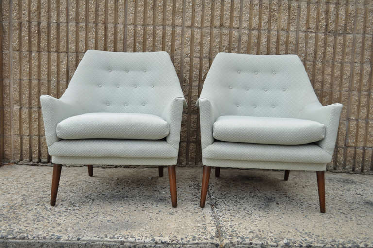 Remarkable pair of Vintage Sculpted Frame Lounge / Club Chairs in the Manner of Gio Ponti. The pair features rolled arms and backs, tapered legs, and clean modernist lines. Origin is possibly Italian