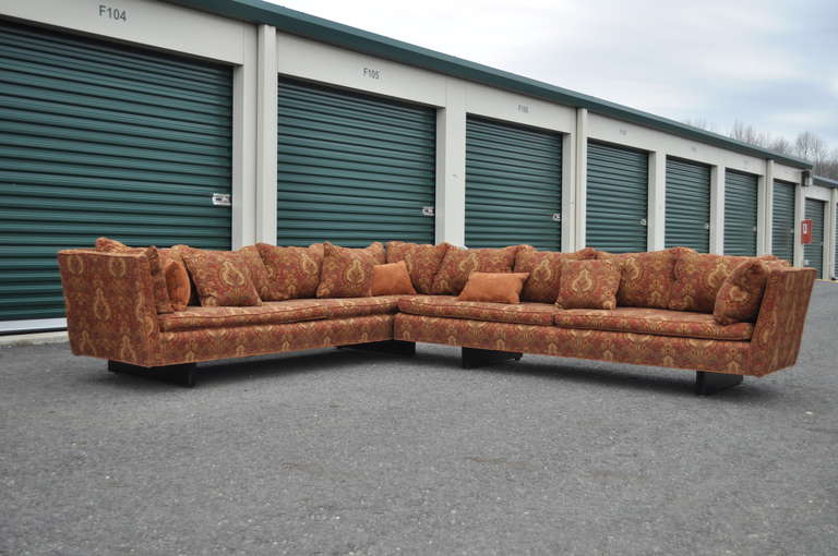 Very rare Edward Wormley for Dunbar (Model 5948) two-part split/floating arm sectional sofa with exposed sculpted wood ebonized frame. Sectional has free-form floating arms and can be used as a sofa with matching chaise longue if not used as a