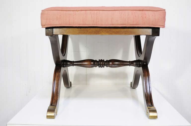 Beautiful Vintage Solid Mahogany and Brass X-Form Bench /  Stool attributed to Dorothy Draper for Heritage Henredon. Item features a beautiful carved solid wood frame, upholstered seat, high quality joinery and construction, brass mounts and foot