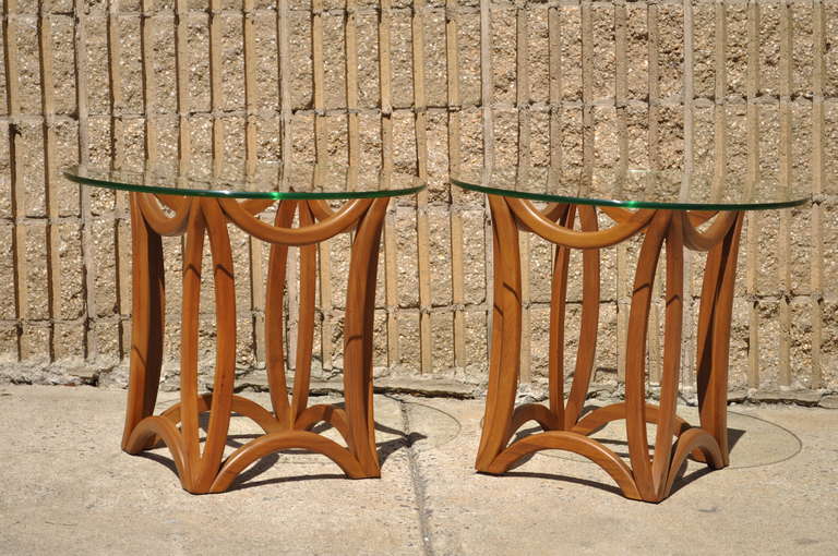 Very unique pair of Mid Century Modern Danish Style End Tables with Sculpted Solid Walnut Bases and Beautiful Round Glass Tops in the Manner of Vladimir Kagan and Adrian Pearsall.