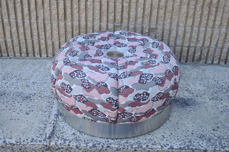 Very Cool Vintage Mid Century Modern Tufted Oversized Ottoman / Coffee Table. The piece features an interesting multi-colored cumulus pattern fabric, and a brushed steel base and button tuft. The designer is unconfirmed as there are no remaining