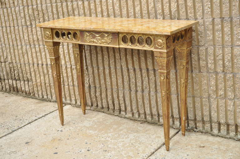 Nicely Hand Carved Gold Gilt Wood Vintage Italian Marble Top Console / Hall Table with ornately carved frame and attractive veins in the marble all in the French Louis XVI / Neoclassical Taste.