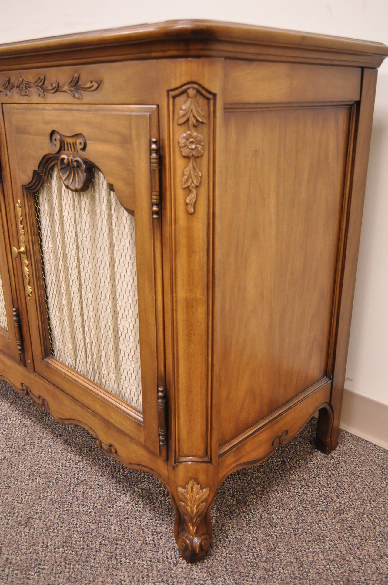 A hand-carved solid cherry sideboard in the French country/Louis XV taste from Kindel's 