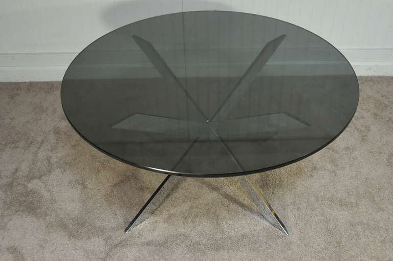 Wonderful Circa 1970 Chrome Plated Solid Steel Star Form Coffee Table with Smoked Glass Round Top by Leon Rosen for Pace. Item features a very sleek form with clean modernist lines.