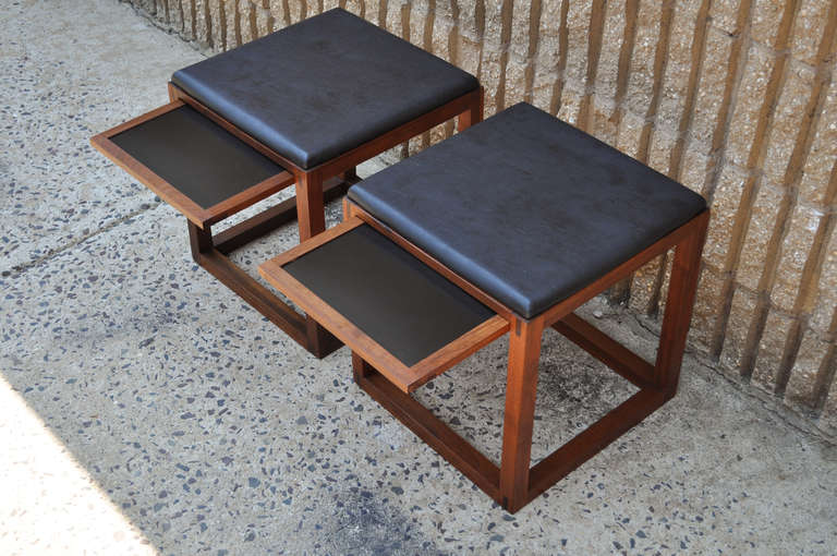 Pair of Vintage Mid Century Modern Solid Walnut Stools believed to be custom made in the Danish Taste. The pieces feature laminate pull out surfaces in order to double as stools/end tables, and are very well constructed, with visually striking and