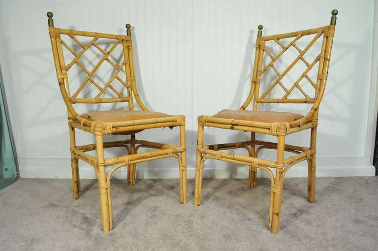 Wonderful Set of 4 Original Vintage Bamboo / Rattan Dining Chairs with Brass Finials and great Chinese Chippendale / Hollywood Regency Form.