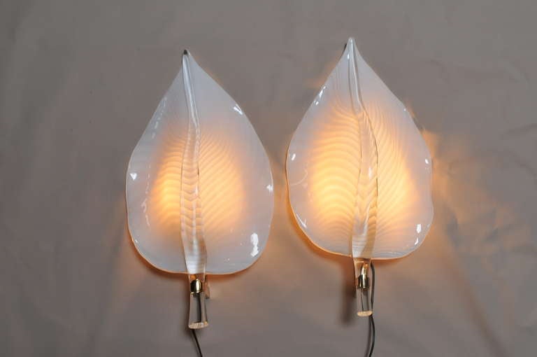 Large pair of vintage single light brass and Murano handblown glass lotus leaf wall sconces. Very classy and elegant.