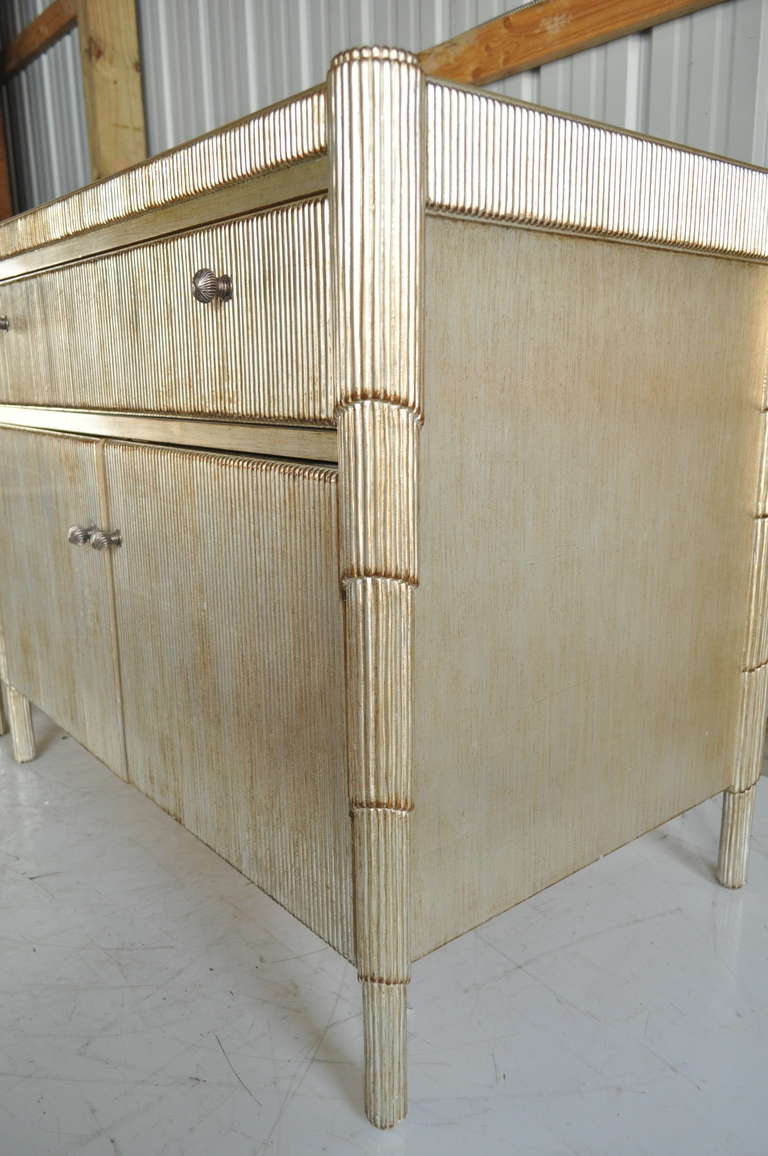 Pair of Nancy Corzine Gold and Silver Leaf Marble Top Cabinets