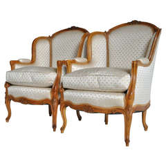 Pair of French Louis XV Style Finely Carved Walnut Bergeres, circa 1920