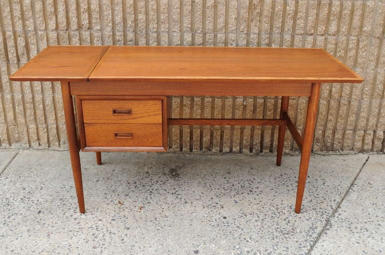 Remarkable Vintage Mid Century Danish Modern Teak & Oak Extendable Desk. This beautiful space saver has the ability to be used with the flap down or also extended by lifting the flap and sliding the top over. This clever item features dovetailed