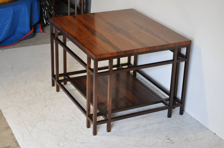 Beautiful Rosewood and Walnut Side Table by Baker Furniture believed to be from their Far East Collection with the design being attributed to Winsor White. Table features two tiers with beautiful rosewood grain and great modernist form.