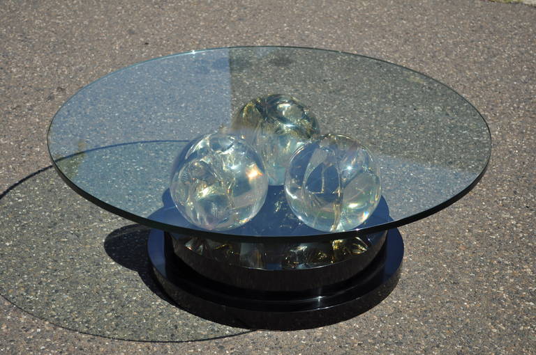 Remarkable and Stunning Mid-Century Modern Triple Spherical Fractured Resin Coffee Table in the manner of Pierre Giraudon. This high quality item features 3 heavy resin spheres on a black lacquered pedestal base and a .75