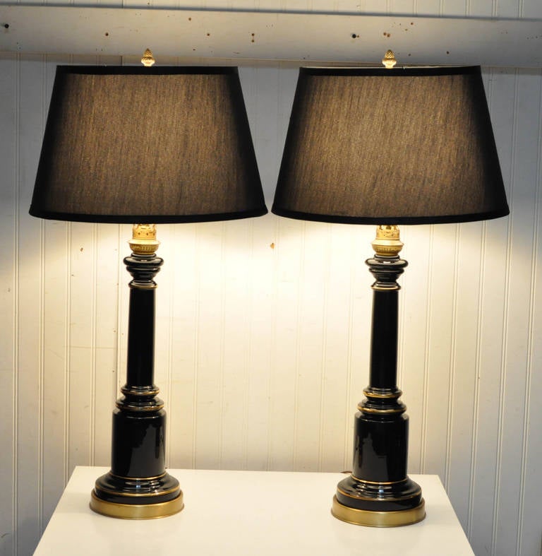 Classy and Elegant Pair of Vintage Black Glass and Brass Column Form Table Lamps in the Neoclassical Style