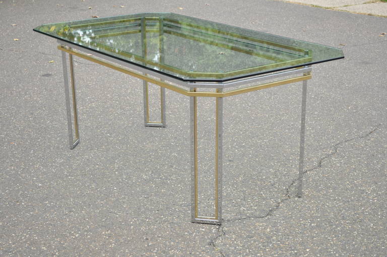 Vintage Mid-Century Modern Chrome, Glass, and Brass Desk or Dining Table attributed to Romeo Rega. Item features a great modernist form with parallel chrome and brass constructed frame, and a notched corner .5