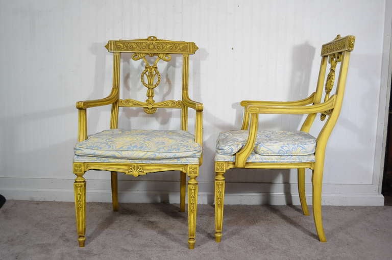 Beautiful set of Vintage French Louis XVI or Regency Style Original Yellow Painted Dining Chairs with Finely and Ornately Carved Solid Wood Frames. The set consists of 2 Armchairs and 4 Side Chairs. Armchairs measure 39