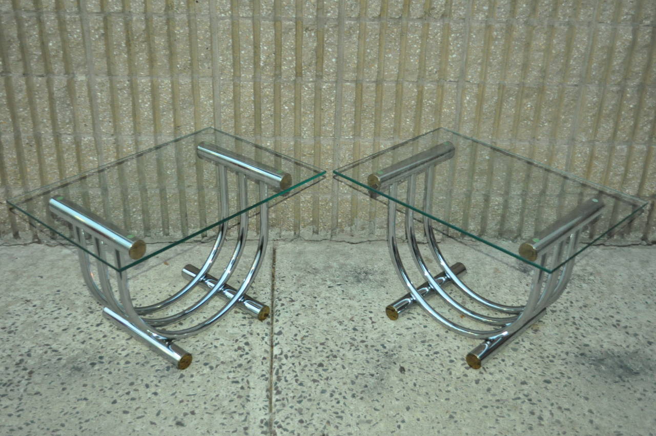 Pair of Striking Vintage Mid Century Modern Chrome, Brass, and Glass Top Side / End Tables attributed to  Romeo Rega. A wonderful modern design with a touch of art deco flare.