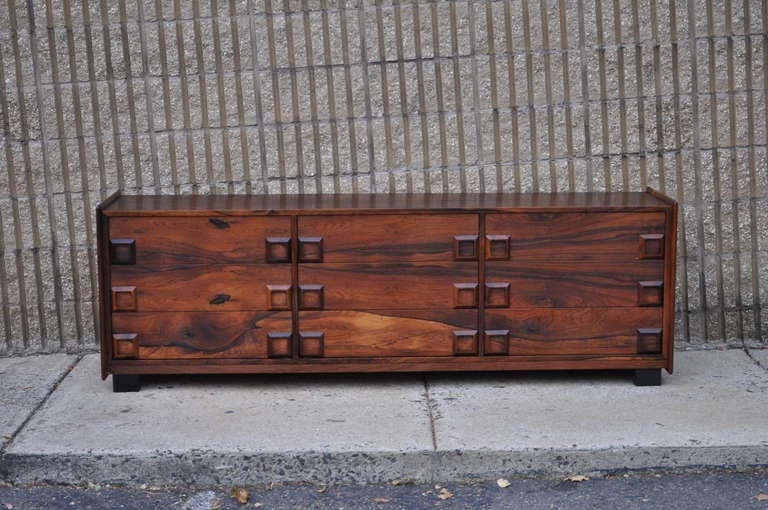 The Most Remarkable Sleek Rosewood 9 Drawer Credenza/Dresser in the Arne Vodder/Danish taste by Inter-Continental Design Limited of Canada. Item features breathtaking rosewood wood grain throughout, large molded wood pulls, nine dovetailed drawers,