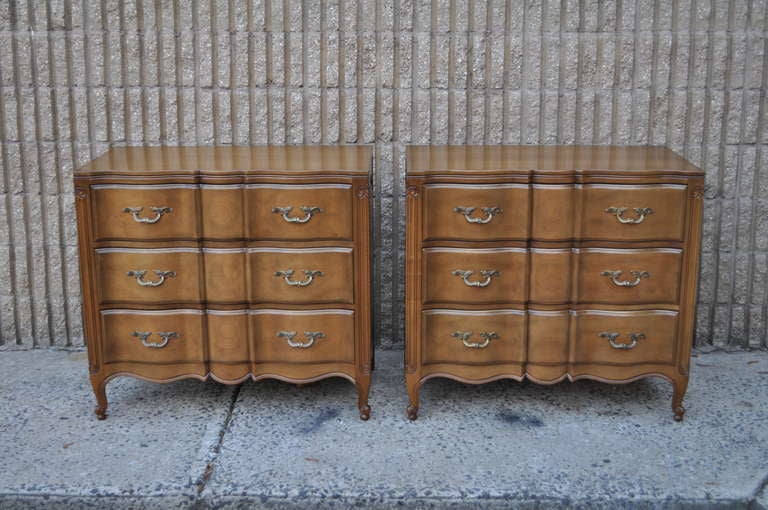 Beautiful and High Quality Pair of Vintage 3 Drawer French Country Louis XV Style Chests by Dixon - Powdermaker. This fine pair features 3 dovetailed drawers, shapely form, raised panel sides, and classic stylish elegance. The wood is believed to be