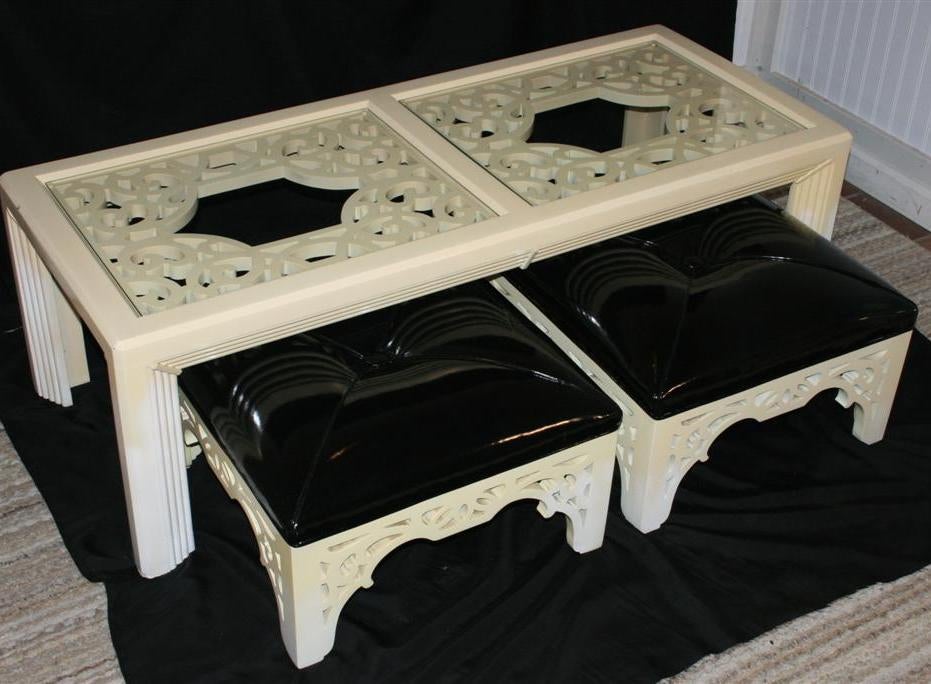 Vintage James Mont Style Coffee Table with Matching Button Tufted Square Ottomans. Ottomans appear to be upholstered in patent leather or vinyl. Set features heavy construction, unique decorative cut outs, two pieces of glasses for the table, and