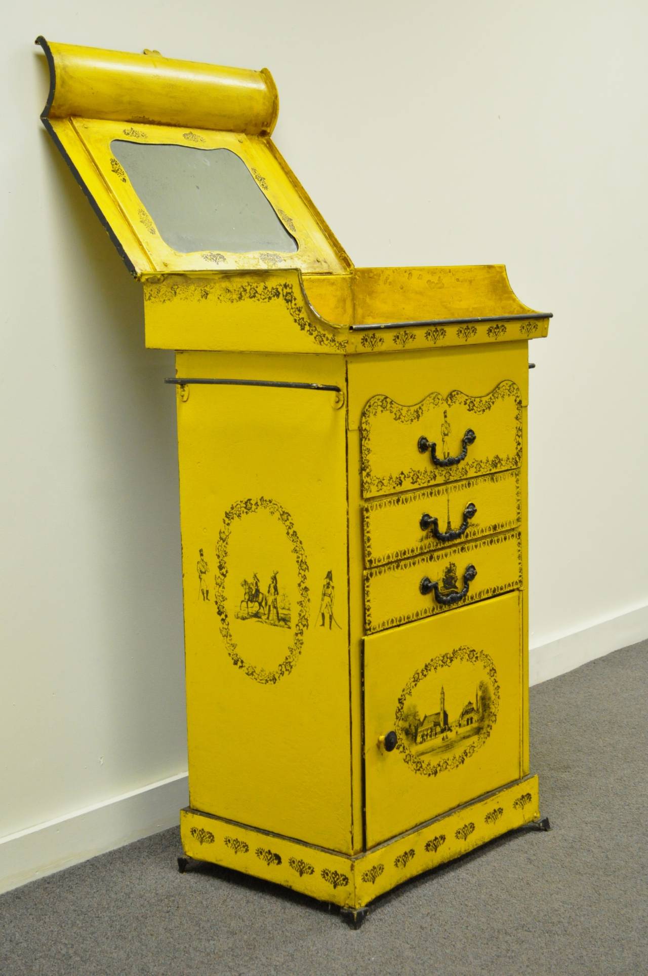 Italian 19th century French style painted tole metal flip-top vanity washstand. Rectangular form, inset water basin with mirror, three drawers, and lower storage. Painted in yellow and decorated with decals of medallions and groups of soldiers,
