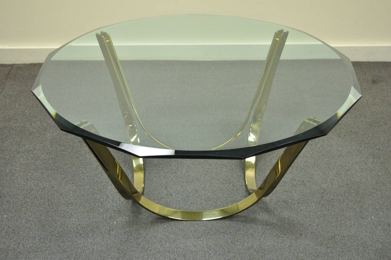 Vintage Mid Century Modern Sculptural Heavy Brass Plated Steel and Glass Coffee Table by Trimark in the manner of Roger Lee Sprunger for Dunbar with the original beveled and shaped .75